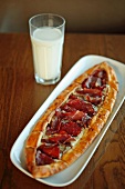 Pide (Turkish flatbread) with air-dried ham