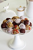 Various chocolate truffles on cake stand
