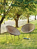 Afternoon break on wicker chairs in garden with refreshing drink