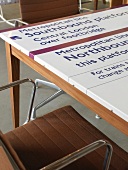 Railway station signs on table