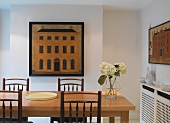 Dining room with pictures on the walls
