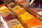 Various spices in plastic containers on a Turkish market