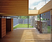 Roofed terrace with stone wall