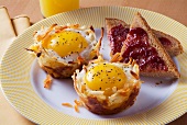 Eggs in Hash Brown Baskets with Toast with Jelly