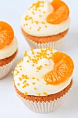 Cupcakes decorated with mandarins
