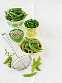 An arrangement of peas (fresh, dried, pods)