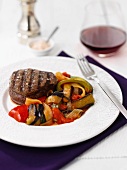 A beef medallion with aubergine ratatouille