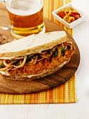 A spicy fish and onion sandwich