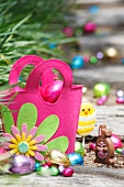 Pink felt bag with chocolate Easter eggs