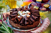 Chocolate torte with chocolate curls and sugar eggs