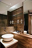 Luxurious bathroom with nut wood panelling and designer wash stand