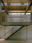 View from living room of staircase separated by glass wall