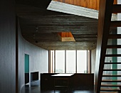 Mezzanine with wooden staircase to upper storey
