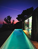 Terrace with swimming pool at dusk