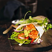 A salmon, mange tout and guacamole wrap