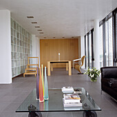 Modern living room with glass coffee table and designer furniture