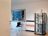 Modern painting and exhibition display case with collectors' items