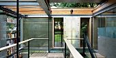 Contemporary solar house building - gallery level with open sliding roof