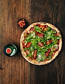Pizza with rocket and dried tomatoes