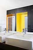 Bathroom with washstands & yellow niches for shower & door