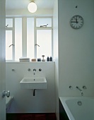 Bathroom with washstand, bathtub & toilet