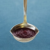 Beetroot sauce in a ladle