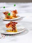 Grilled scallops with prosciutto and melon