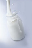 Milk being poured into a bottle
