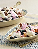 Meringue with pecan nuts, blueberries and blueberry yogurt