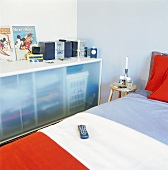 Console cabinet with glass doors in bedroom