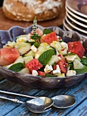 A summer salad with melon, mint, feta and pomegranate