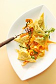Rabbit-filled ravioli and grated carrot