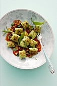 Herb gnocchi with vegetable sauce