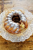 A marbled Bundt cake with icing sugar