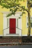 Yellow house with red front door