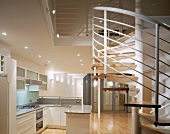 Open-plan kitchen with spiral staircase