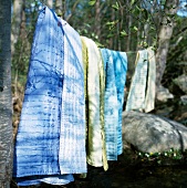 Bedspreads hanging on a washing line