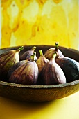 Fresh figs in wooden dish