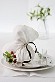 Christmas pudding wrapped in napkin as a party favour