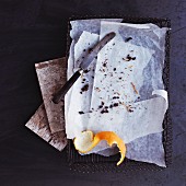 Cake crumbs and orange peel on baking paper