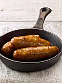Pan fried pork sausages with honey