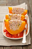 Pumpkin wedges filled with minced meat, pistachios and rice