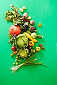 Various vegetables on a green wooden surface