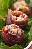 Gorgonzola Stuffed Figs Wrapped in Bacon on a Bed of Lettuce