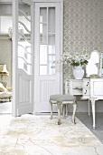 Rococo dressing table and upholstered stool next to open double doors