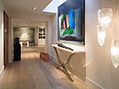 Modern hall with wide doorway and view of living room