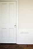 White-painted, panelled interior door