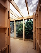 View into wooden extension with open garden door