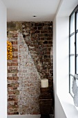 Detail of battered brick interior wall