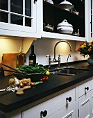 Food preparation on work surface of country house style kitchen counter